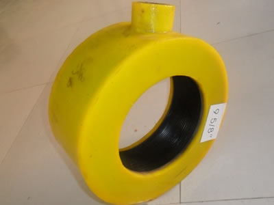 A yellow dismountable inflatable thread protector is on the ground.