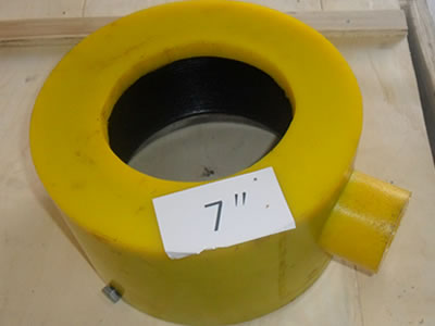 A yellow dismountable inflatable thread protector of 7 inch is on the table.