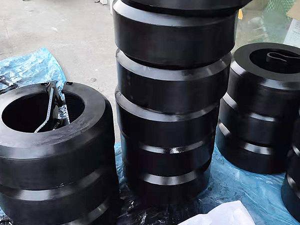 Several piles of quick release thread protectors on plastic film