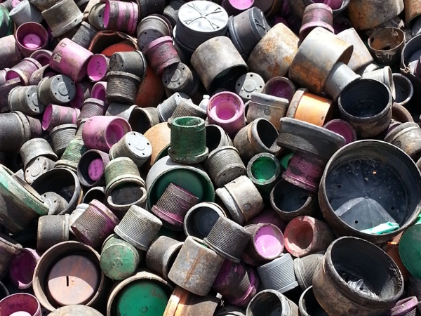 Many deformed thread protectors stacked together